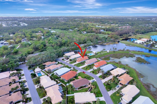 birds eye view of property featuring a water view