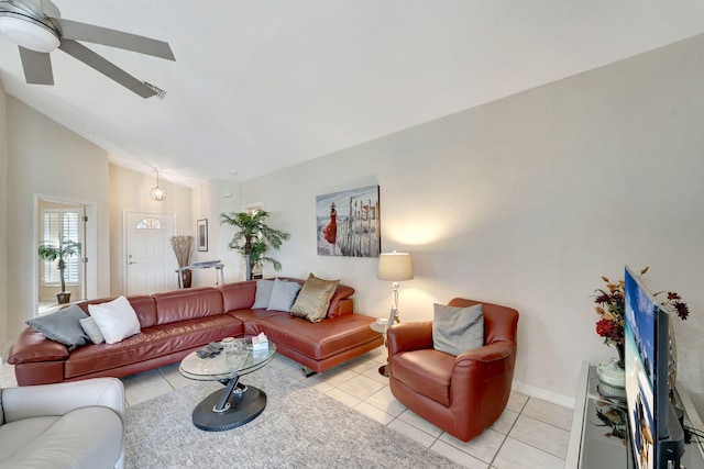 living room featuring ceiling fan, light tile patterned flooring, and high vaulted ceiling