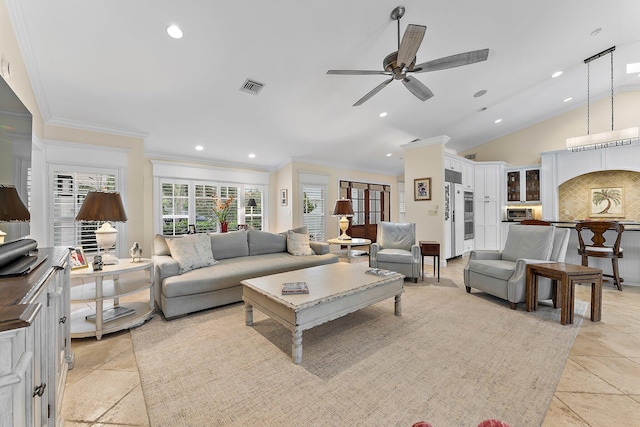 living room featuring lofted ceiling, ceiling fan, and crown molding