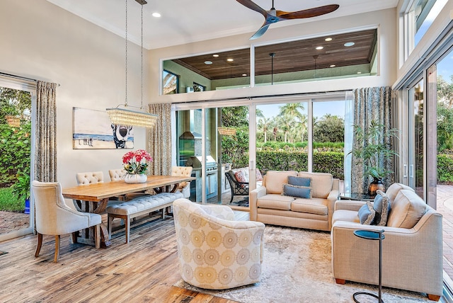 7190 Tradition Cove Ln E, West Palm Beach, FL 33412 - living area featuring a towering ceiling, ornamental molding, wood finished floors, ceiling fan, and recessed lighting