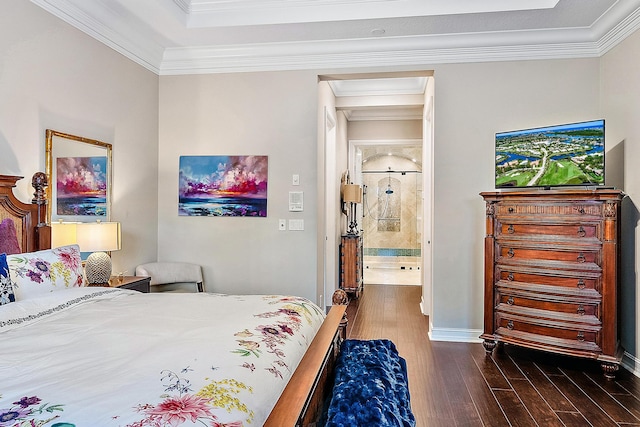 bedroom with dark hardwood / wood-style floors, crown molding, and ensuite bathroom