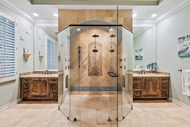 bathroom featuring crown molding, a shower with door, and vanity