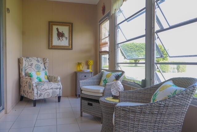 sitting room featuring light tile patterned floors and a healthy amount of sunlight