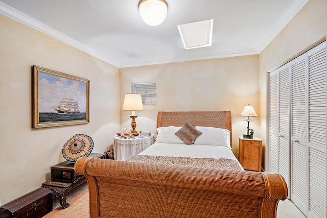 bedroom featuring ornamental molding, carpet floors, and a closet