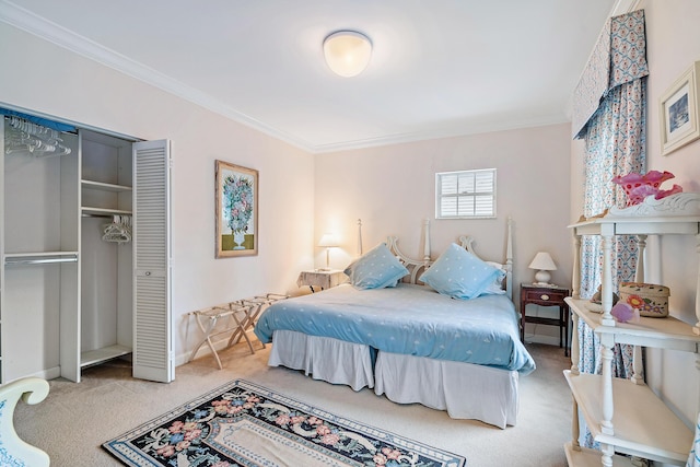 carpeted bedroom with crown molding, baseboards, and a closet