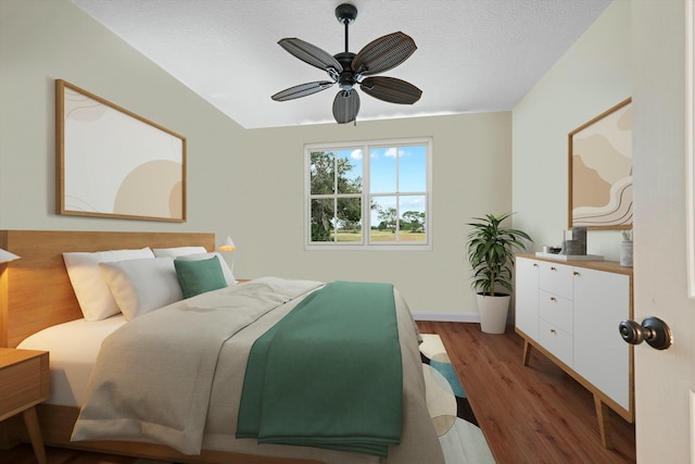 bedroom with ceiling fan, dark hardwood / wood-style flooring, and a textured ceiling