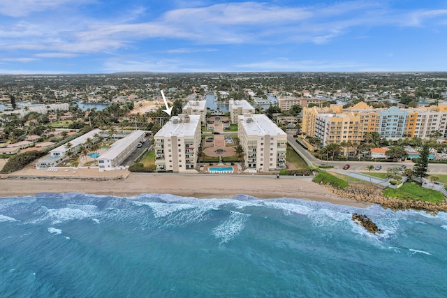 birds eye view of property featuring a water view and a view of the beach