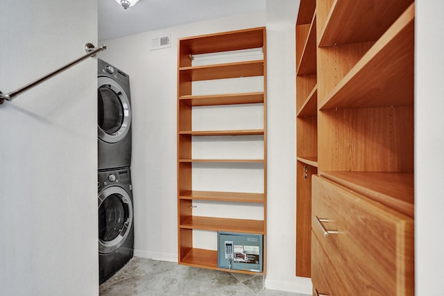 laundry room featuring stacked washer and dryer