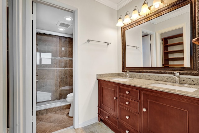 bathroom featuring an enclosed shower, vanity, crown molding, tile patterned flooring, and toilet