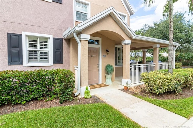 property entrance with covered porch