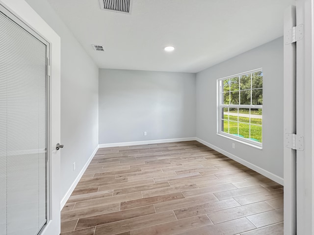 unfurnished bedroom with light wood-type flooring