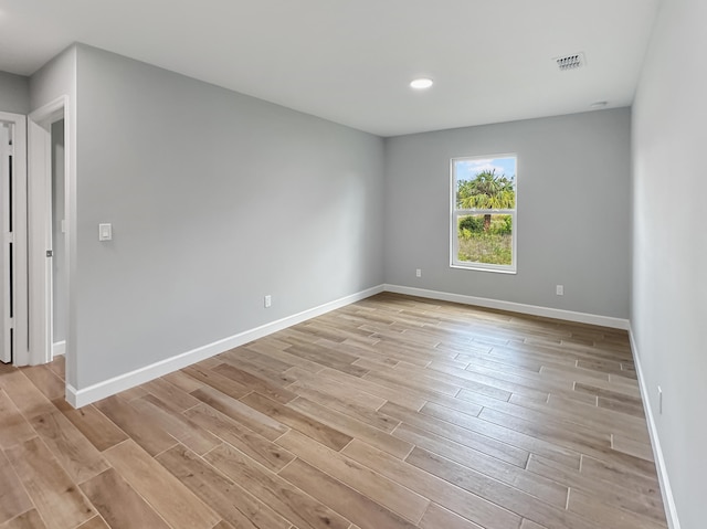 spare room featuring light hardwood / wood-style floors