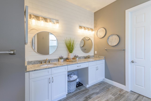 bathroom featuring vanity and hardwood / wood-style flooring