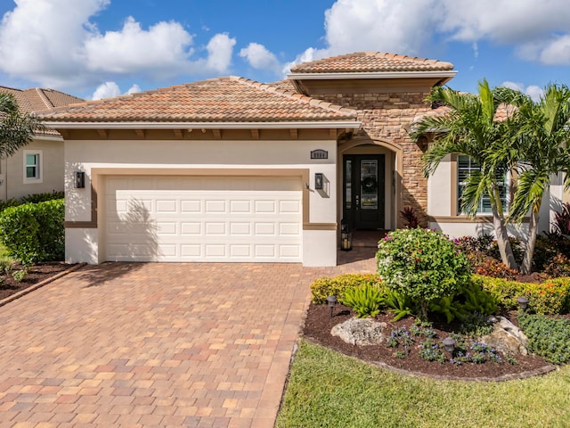 mediterranean / spanish house featuring a garage