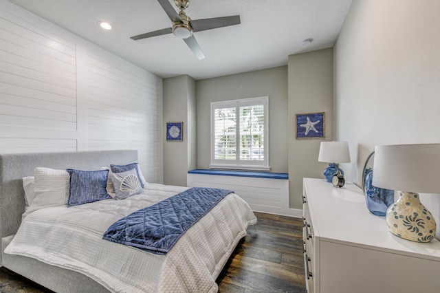 bedroom with dark hardwood / wood-style floors and ceiling fan