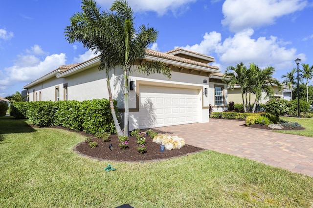 view of side of home featuring a garage and a lawn