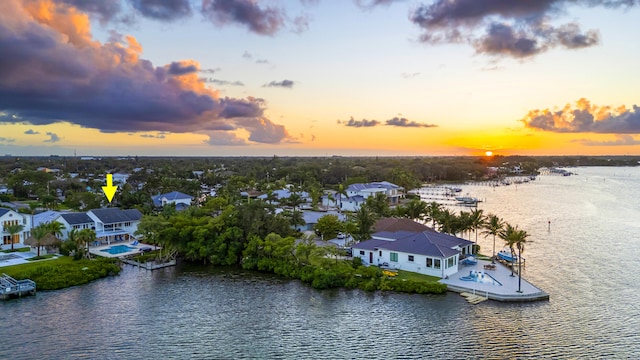 aerial view at dusk with a water view