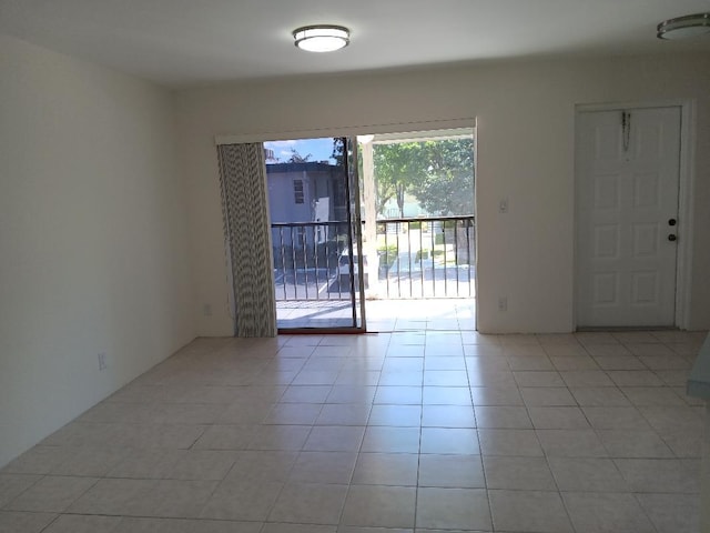 spare room with light tile patterned floors