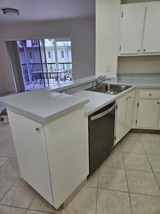 kitchen with kitchen peninsula, white cabinetry, dishwasher, and light tile patterned floors