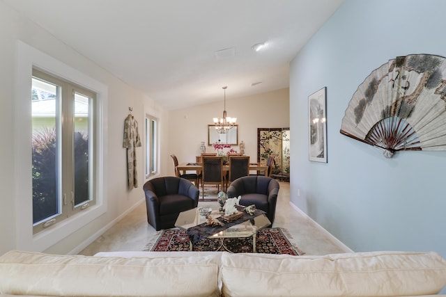 living room featuring light carpet, vaulted ceiling, and an inviting chandelier