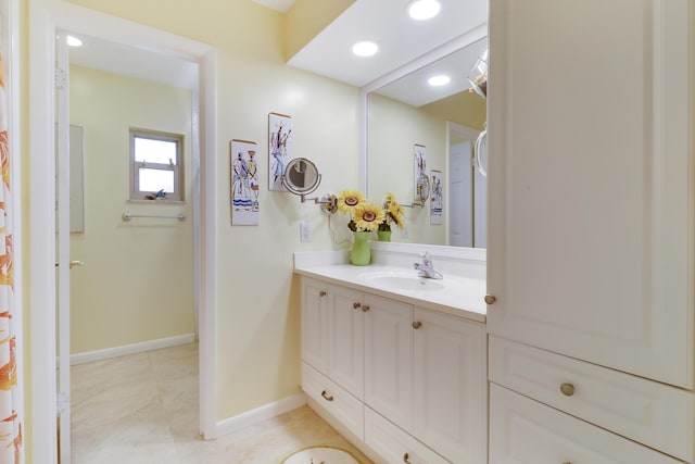 bathroom with tile patterned floors and vanity