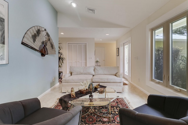 tiled living room with vaulted ceiling