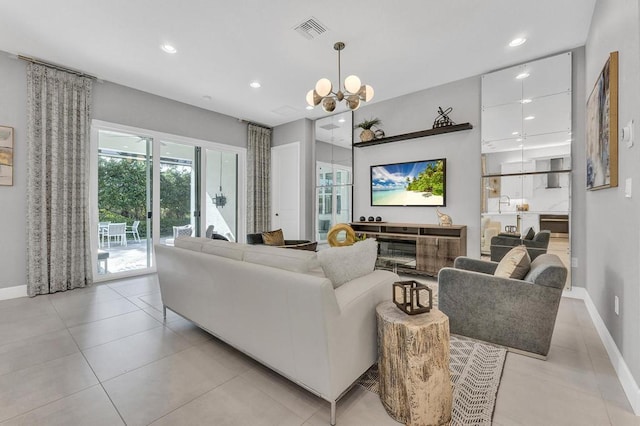 tiled living room featuring a chandelier