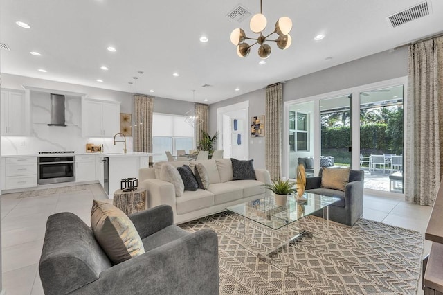 tiled living room with an inviting chandelier and sink