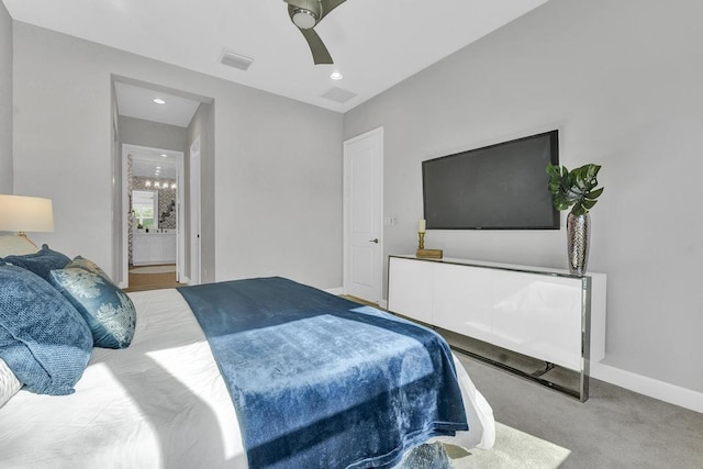 carpeted bedroom featuring connected bathroom and ceiling fan