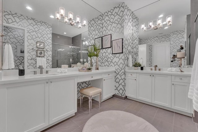 bathroom featuring vanity, tile patterned floors, and walk in shower