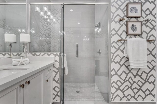 bathroom featuring vanity and an enclosed shower