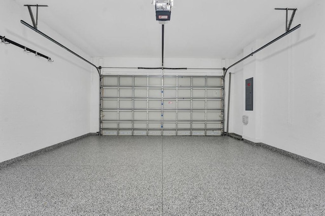 garage featuring electric panel and a garage door opener