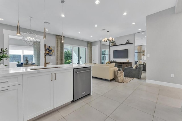 kitchen featuring white cabinets, decorative light fixtures, and an inviting chandelier