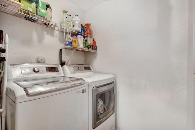 laundry room with independent washer and dryer