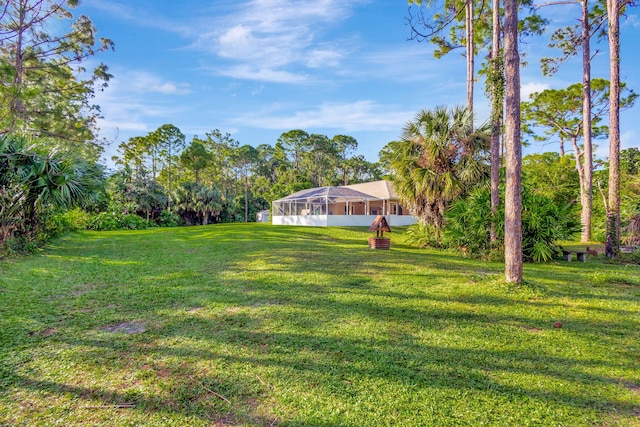 view of yard with a lanai