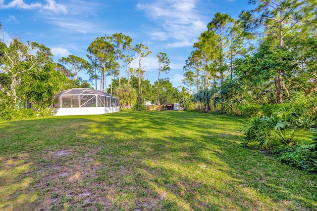 view of yard featuring a lanai