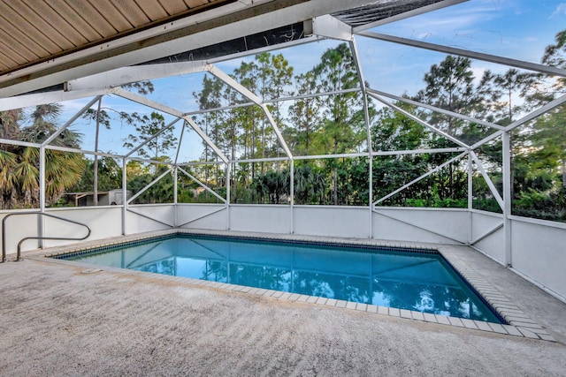 view of pool featuring a lanai and a patio