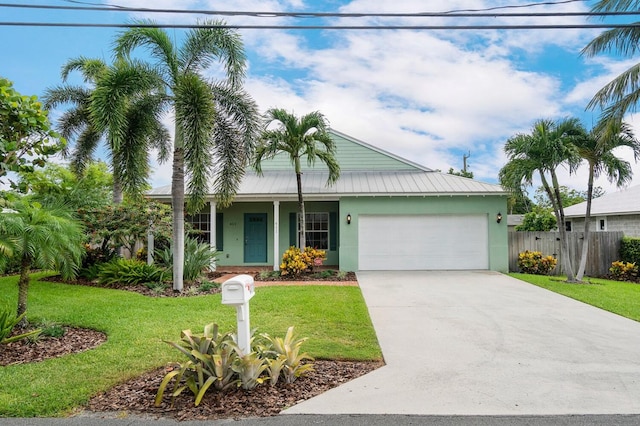 view of front of property with a front lawn and a garage