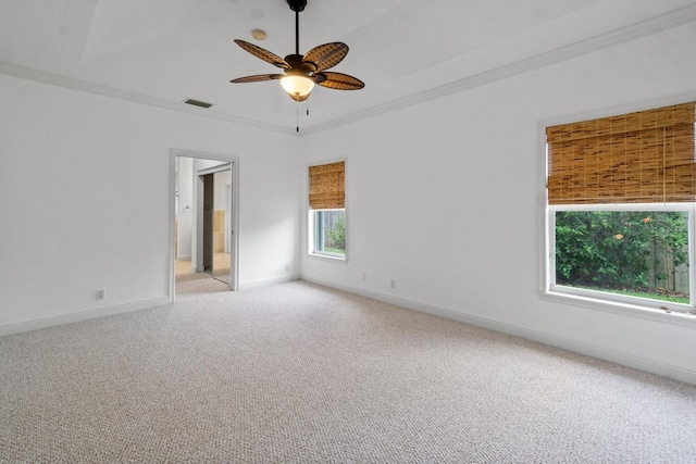 carpeted spare room with ornamental molding and ceiling fan