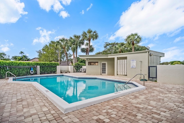 view of swimming pool with a patio area