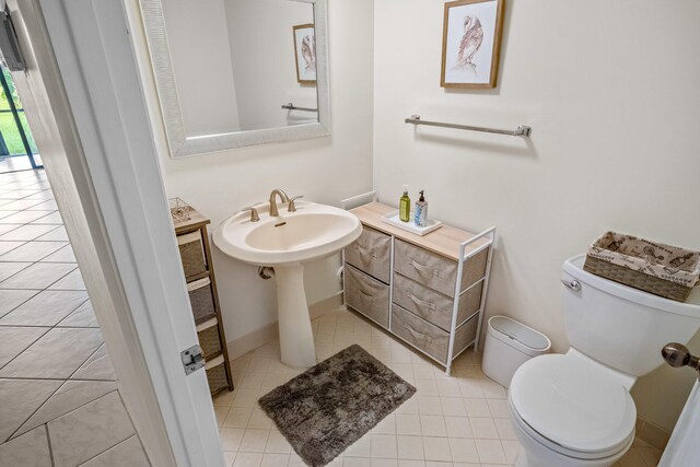 bathroom with tile patterned floors and toilet