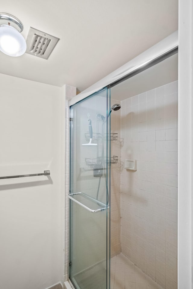 bathroom featuring an enclosed shower