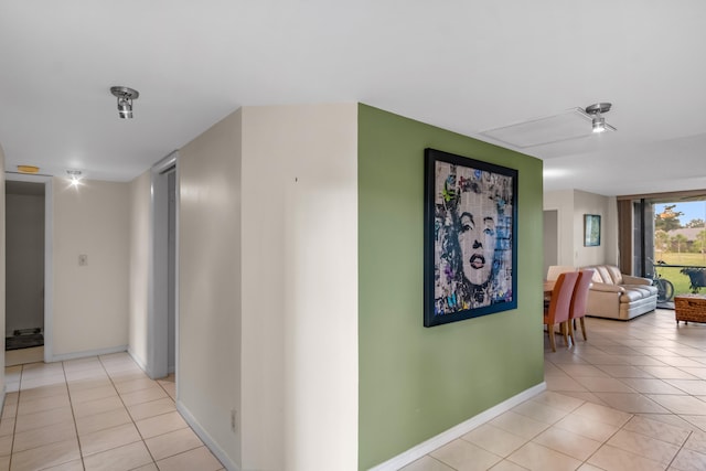 hallway with light tile patterned floors