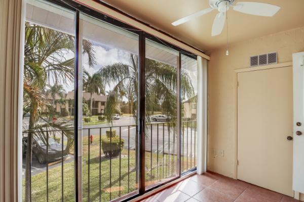 entryway with ceiling fan and light tile patterned floors