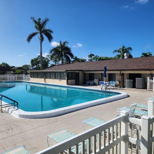 view of swimming pool featuring cooling unit and a patio area