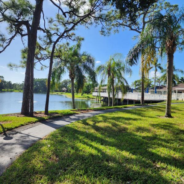 view of community featuring a yard and a water view