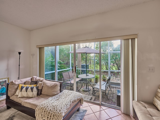 tiled living room with a textured ceiling