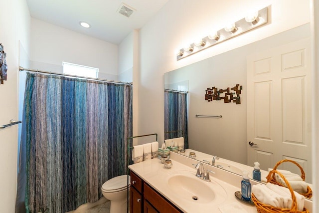 bathroom featuring tile patterned flooring, vanity, toilet, and a shower with shower curtain