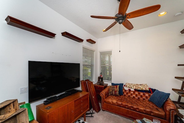 carpeted living room featuring ceiling fan