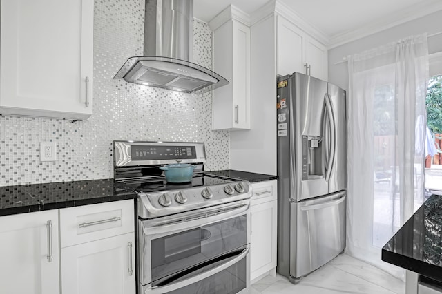 kitchen featuring white cabinets, wall chimney exhaust hood, decorative backsplash, ornamental molding, and stainless steel appliances